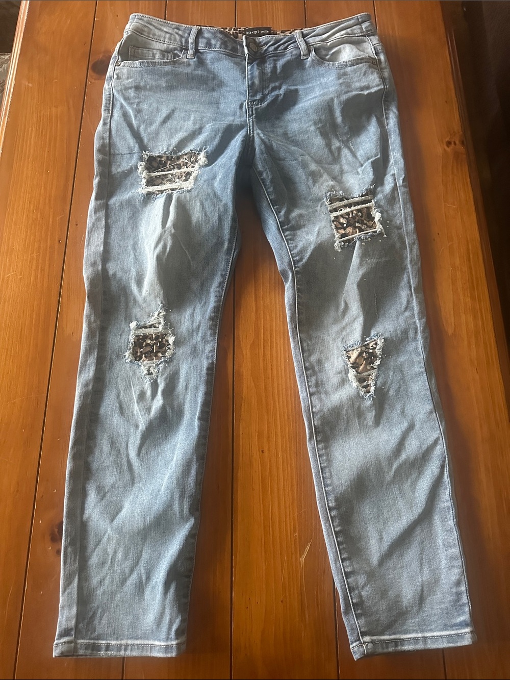 BeBe size 31 jeans with cute cut outs